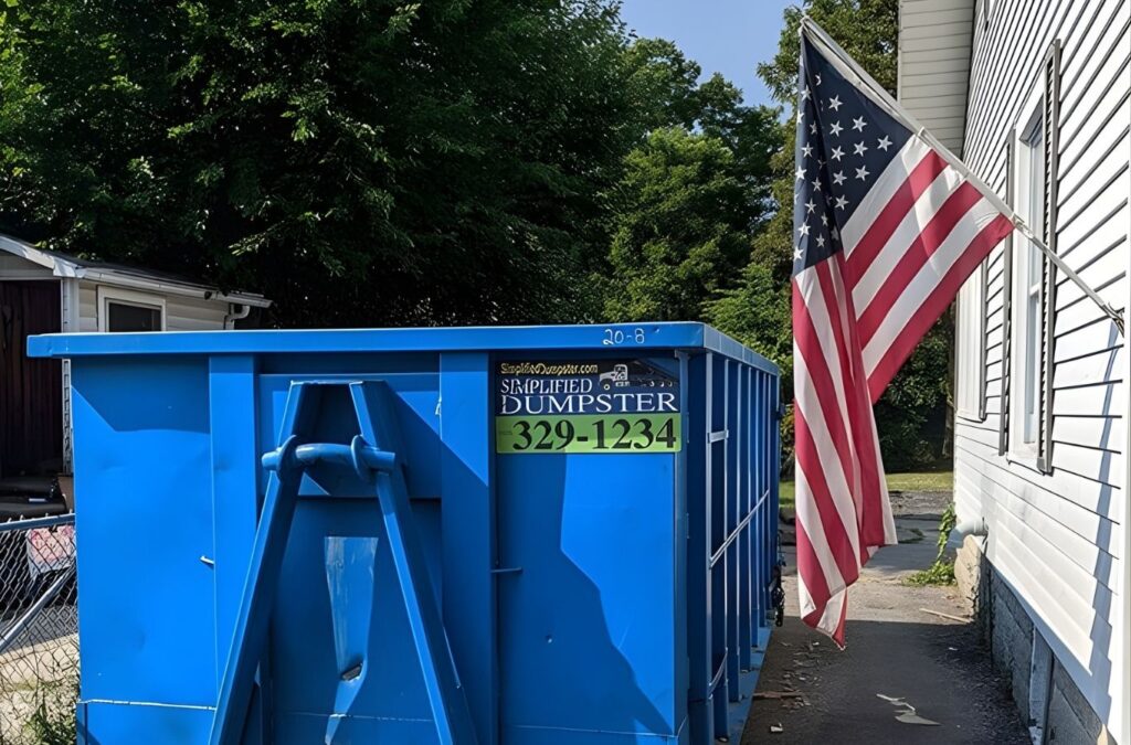 Homeowner loading Residential Dumpster Rental debris outside a Laingsburg - MI property during renovation work. Residential Dumpster Rental near me.